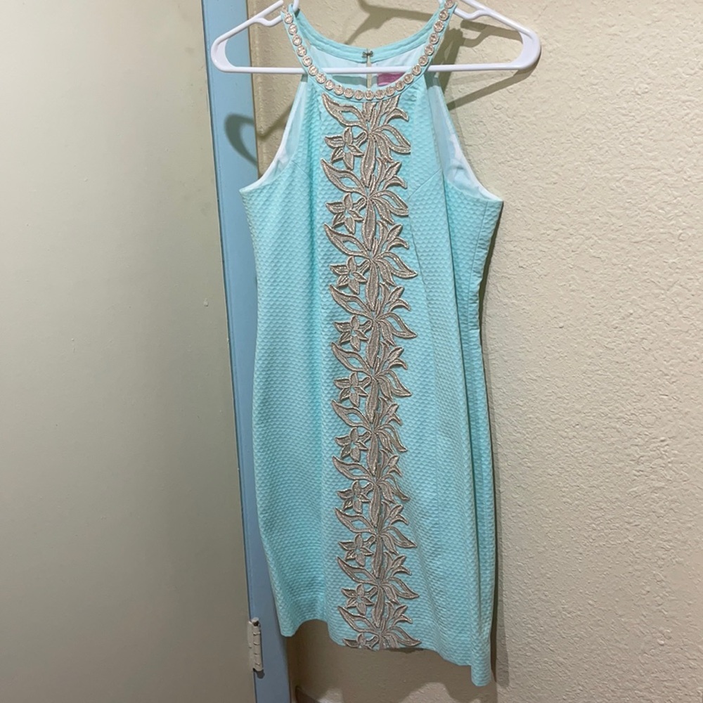 Never worn, mint green 👗 with gold lace details